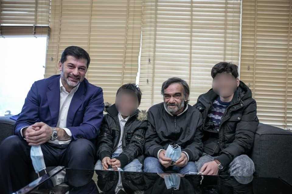 Tbilisi Mayor Kakha Kaladze posing with a family that he personally gifted with a flat.